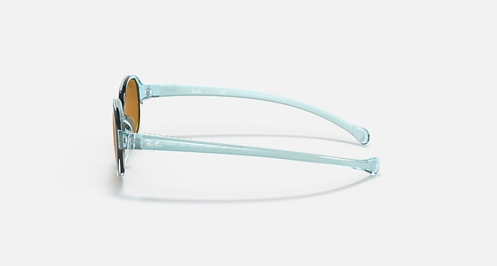 Kids sunglasses side view with transparent light blue frame and brown lenses