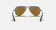 Gold aviator sunglasses with brown gradient lenses and metal wire frame