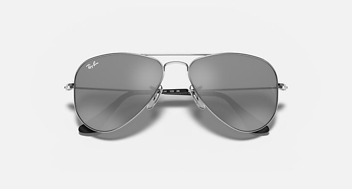 Metal aviator sunglasses with dark gray tinted lenses and silver-tone frame, hinge detail