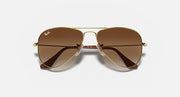 Ray-Ban aviator sunglasses, gold metal frame with brown gradient lenses and bridge detail
