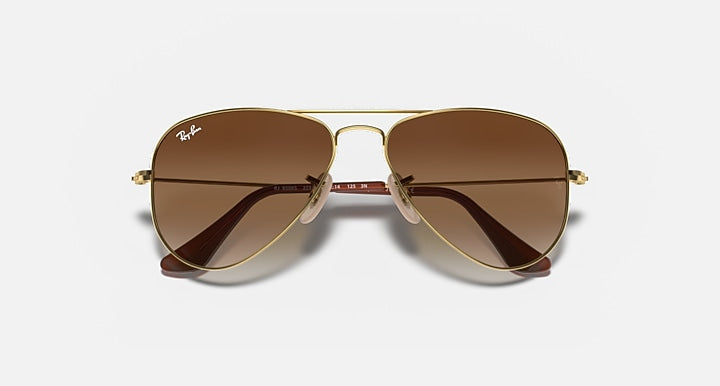 Ray-Ban aviator sunglasses, gold metal frame with brown gradient lenses and bridge detail