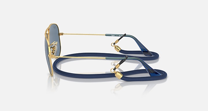Ray-Ban aviator sunglasses with gold frame, blue mirrored lenses, and blue temples