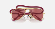 Ray-Ban aviator sunglasses with rose-gold frame and maroon gradient lenses, close angle