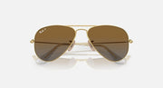 Ray-Ban aviator sunglasses with gold frame and dark brown gradient lenses, centered