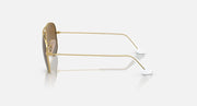 Ray-Ban aviator sunglasses with gold frame, side profile, clear lenses and white temples