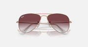 Metal aviator sunglasses with rose-gold frame and dark maroon gradient lenses, close front view