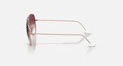 Metal aviator sunglasses, rose-gold frame with dark maroon gradient lenses, side profile