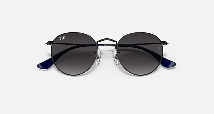 Ray-Ban round sunglasses with black frame top and dark lenses, blue temple arms