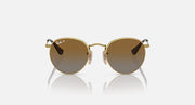 Round Ray-Ban sunglasses with gold frame and dark brown tinted lenses