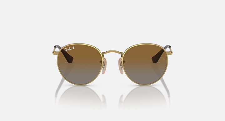 Round Ray-Ban sunglasses with gold frame and dark brown tinted lenses