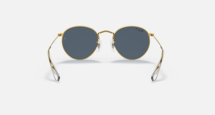 Gold round sunglasses with dark lenses and curved nose bridge, full front view.
