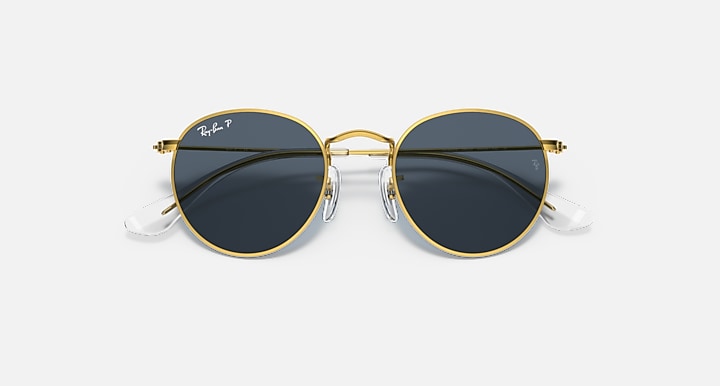 Gold round sunglasses with dark lenses, thin metal frame and small logo on arms.