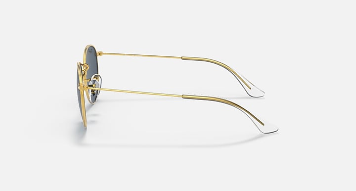 Gold sunglasses side profile with round frame, dark lens, and thin metal arms.