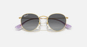 Round Ray-Ban sunglasses with gold frame and brown gradient lenses