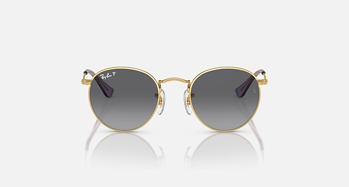 Round Ray-Ban sunglasses with thin gold frame and dark gray lenses