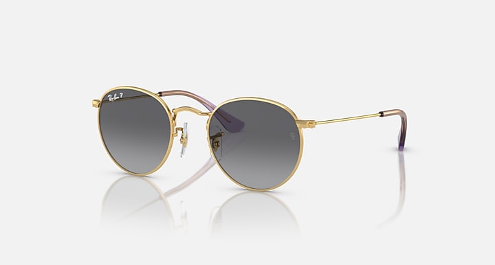 Round Ray-Ban sunglasses with gold frame and dark gray gradient lenses