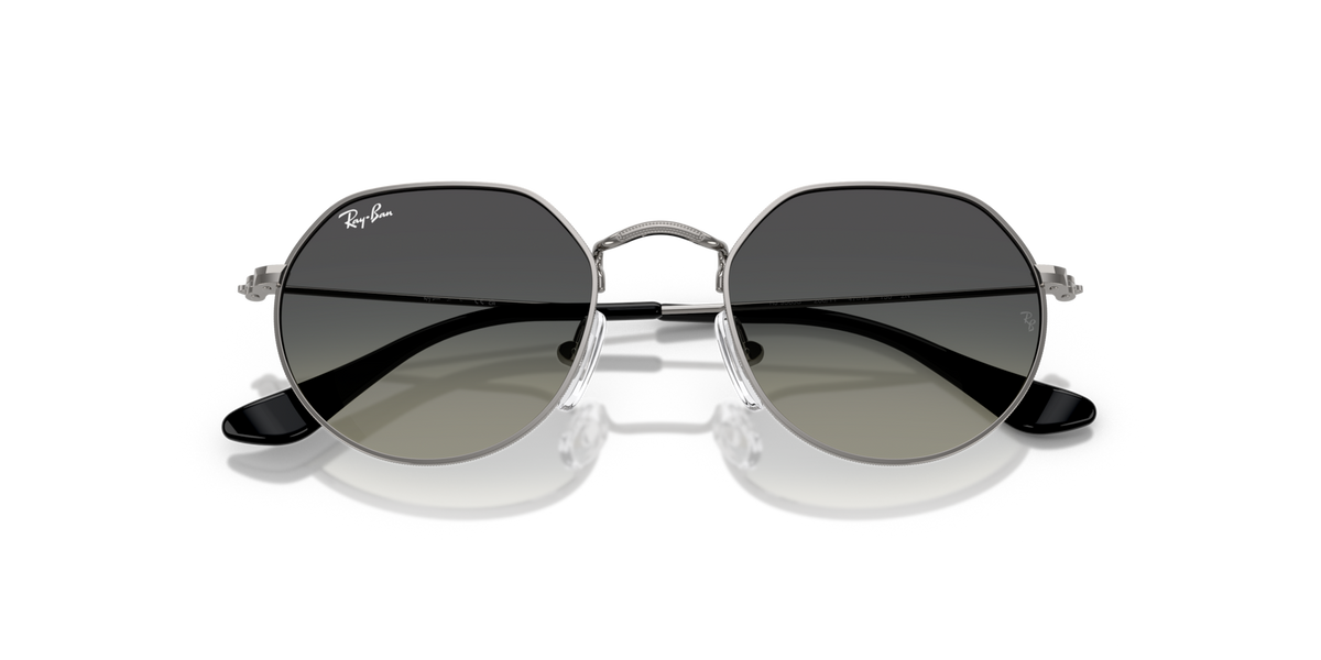Round metal sunglasses with dark lenses and silver frame, angled front view