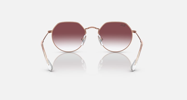 Ray-Ban Junior Jack kids round sunglasses, rose gold frame, dark maroon gradient lenses, front view.