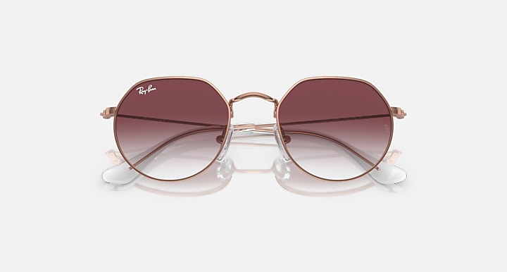 Ray-Ban Junior Jack kids round sunglasses, rose gold frame, dark gradient lenses, two-lens front view.