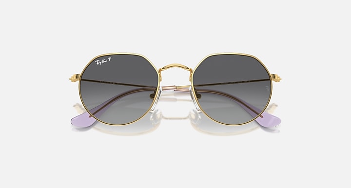 Ray-Ban Junior Jack kids round sunglasses, gold frame, dark gray gradient lenses, purple temple tips.