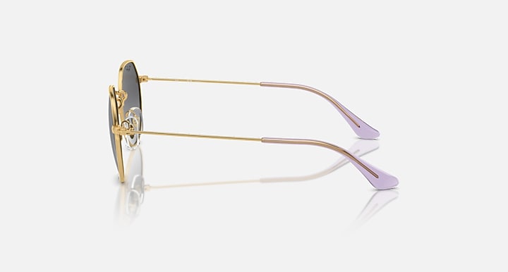 Ray-Ban Junior Jack kids round sunglasses, gold frame, side view, purple temple tips, clear nose pads.