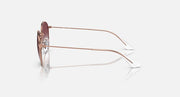 Ray-Ban Junior sunglasses side view with rose-gold metal arms and white tips