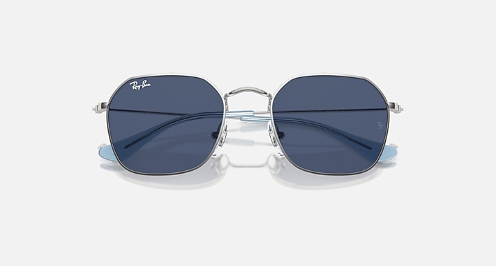 Kids sunglasses with silver frame and dark blue gradient lenses, close front view
