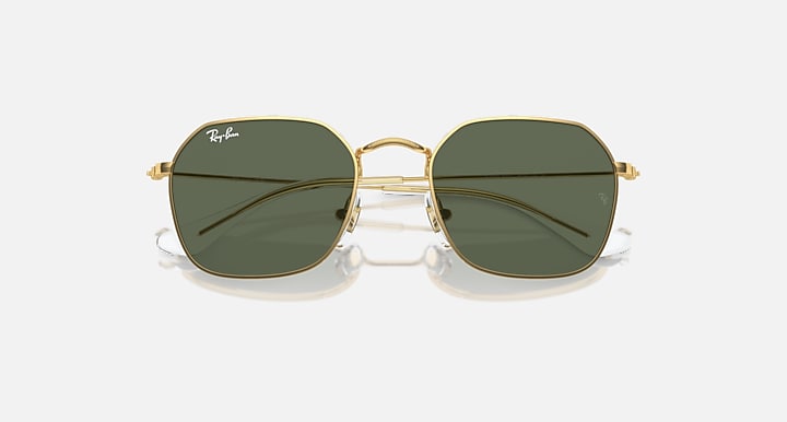 Kids sunglasses with gold frame and dark green lenses, close front view