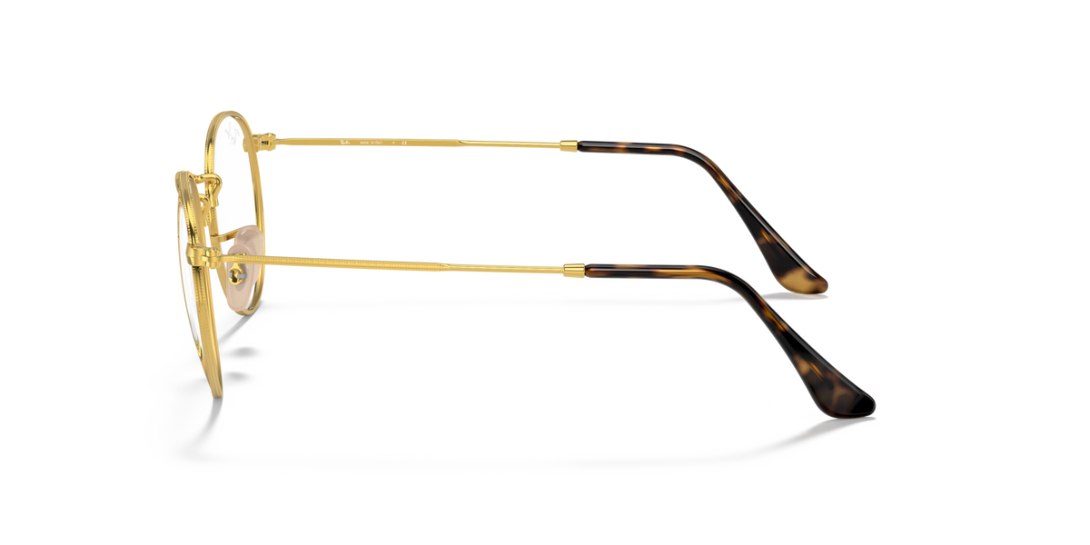 Ray-Ban round metal prescription eyewear frames, gold-tone side view with dark temples