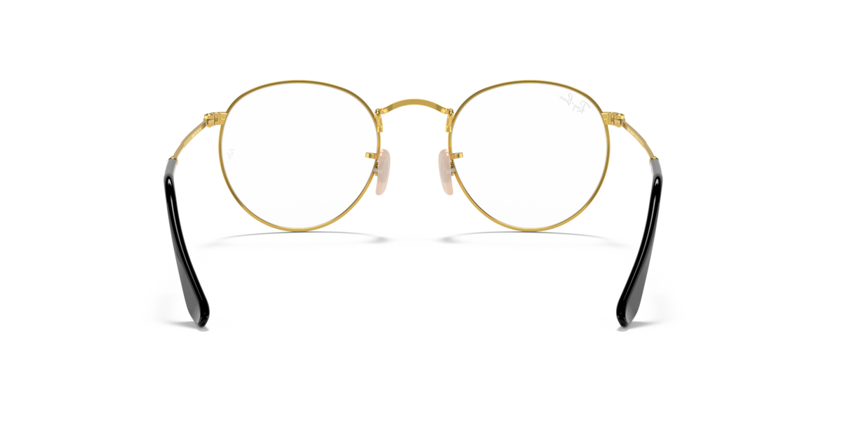 Round metal prescription eyeglass frames with gold rims and black temple tips