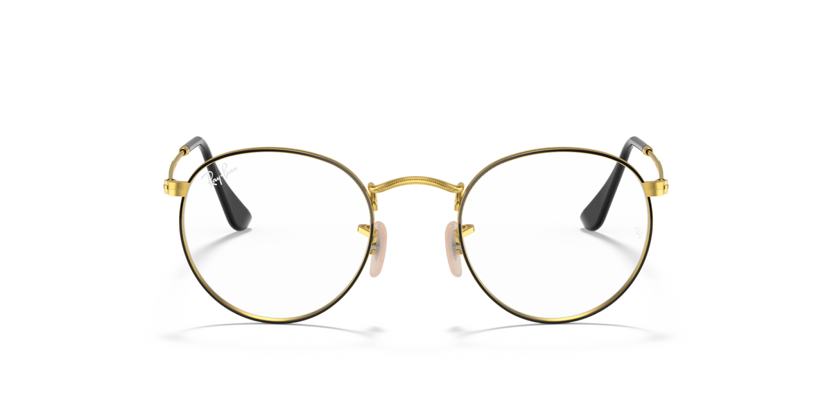 Round metal prescription eyeglass frames with gold rims and dark lenses