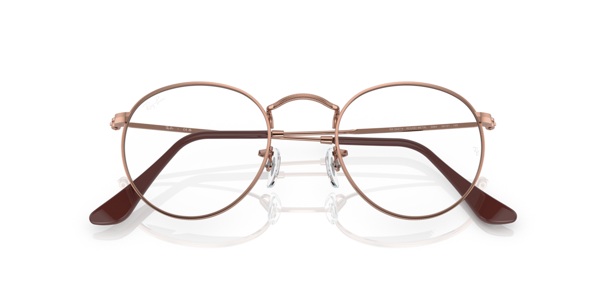 Round metal prescription eyewear frames, rose-gold tone with dark brow bar details