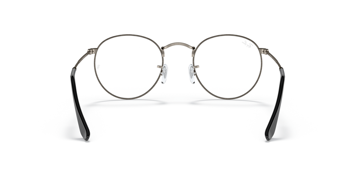 Round metal prescription eyeglass frames with gunmetal rims and dark lenses