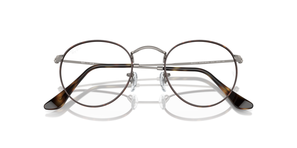 Overlapping front view of round metal prescription eyeglass frames with dark rims
