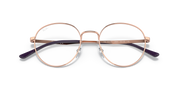 Ray-Ban prescription frames with rose-gold metal rims and clear lenses, close-up