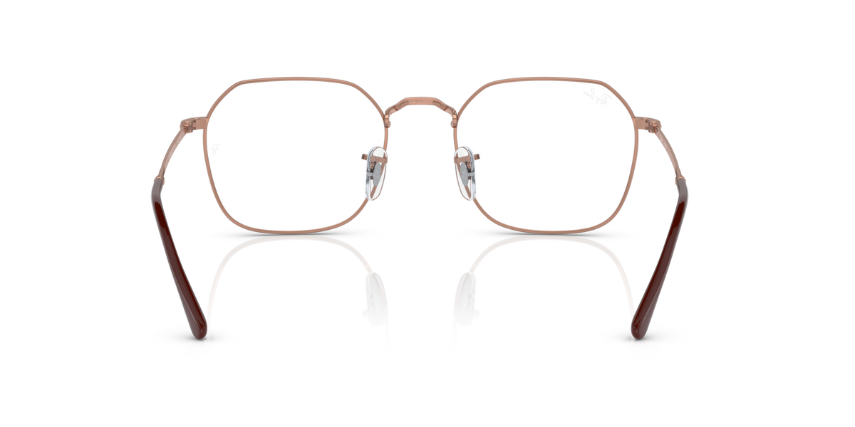 Front view of oval prescription frames with clear lenses, rose-gold metal, dark tips