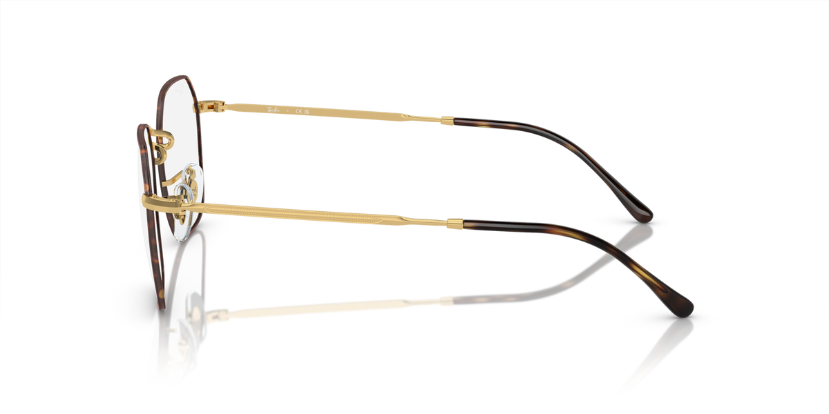 Gold-tone eyeglass frames side view with curved metal temples and arms