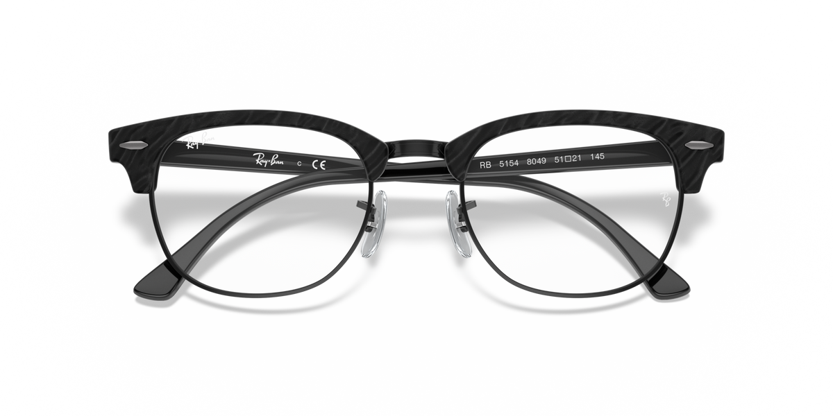 Black eyeglass frames with clear lenses and temple branding/CE markings