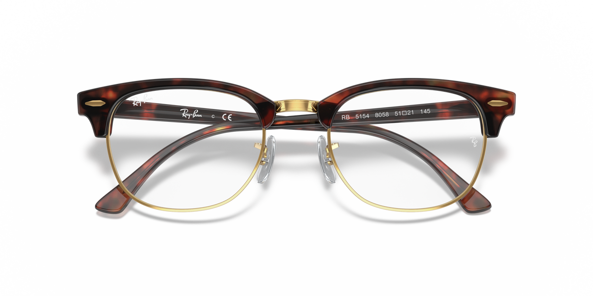 Clubmaster eyeglass frames in dark tortoise with gold bridge and logo detail
