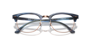 Blue eyeglass frames with gold metal temples and round prescription lenses