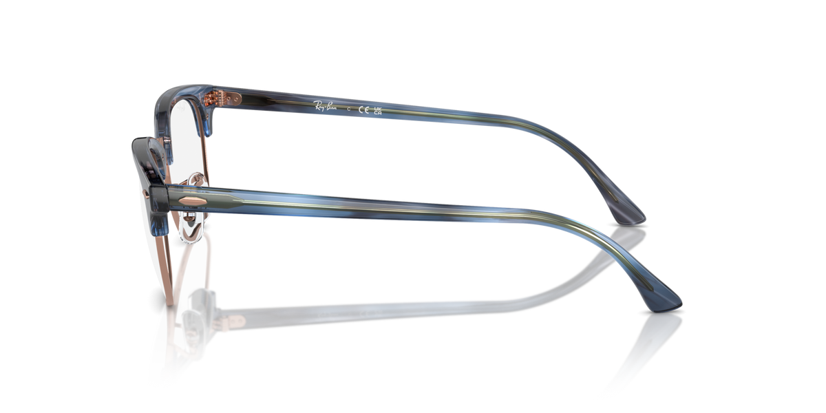 Blue metal eyeglass frames shown from the side with prescription lenses