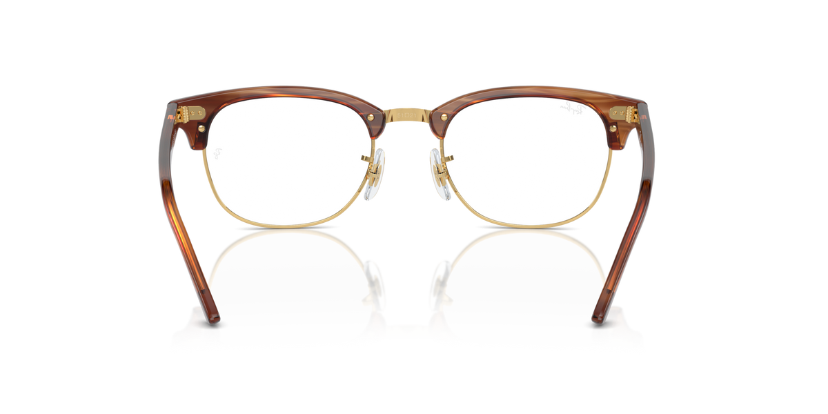 Brown tortoise-style eyeglass frames with round prescription lenses