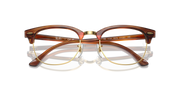 Brown eyeglass frames with gold rims and round prescription lenses