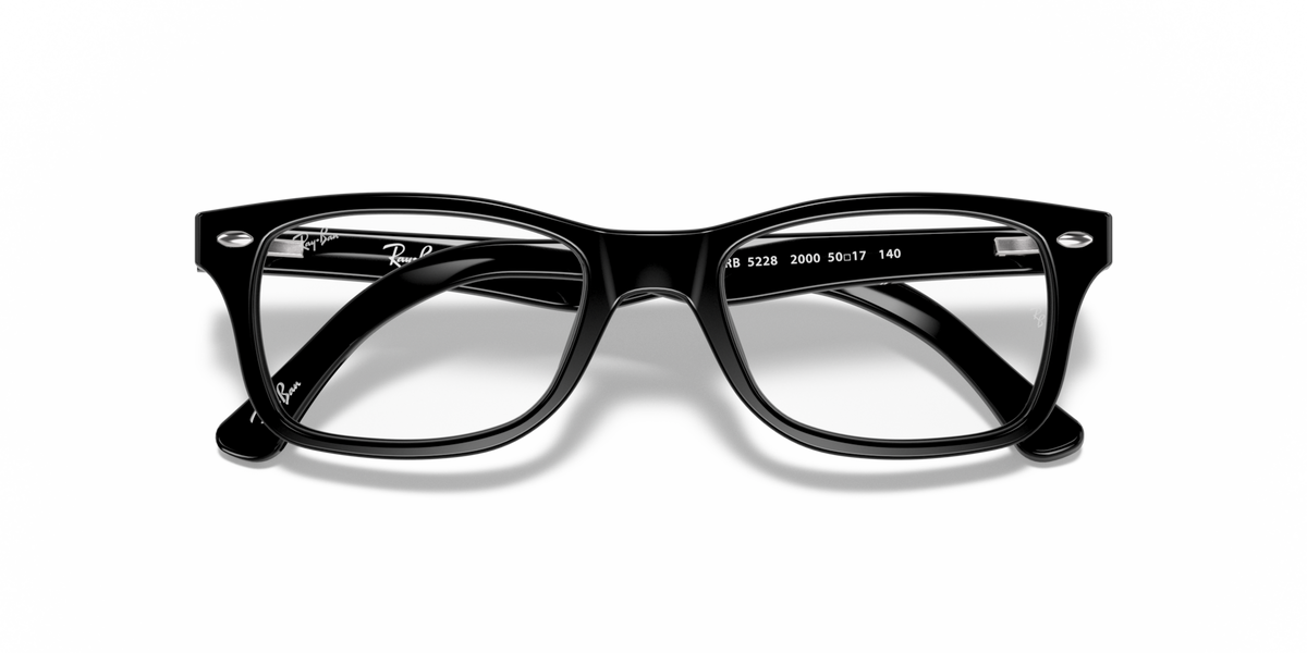 Black prescription eyewear frames with rectangular lenses and marked temple arms