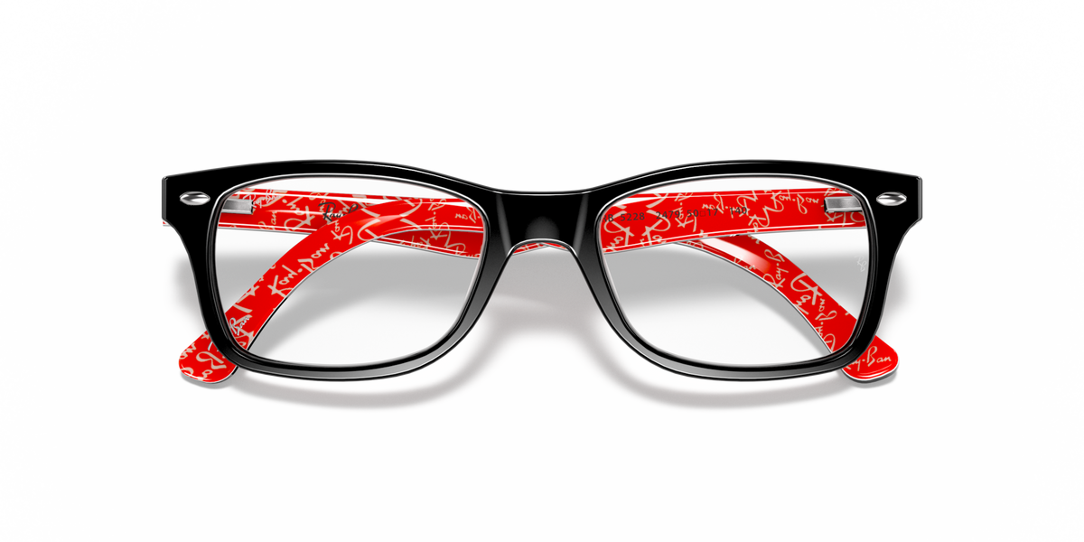 Prescription eyewear frames, black frame with bold red patterned inlays on the front.