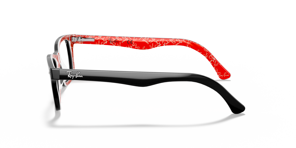 Prescription eyewear frames, black frame with red temple interior detail, side view.