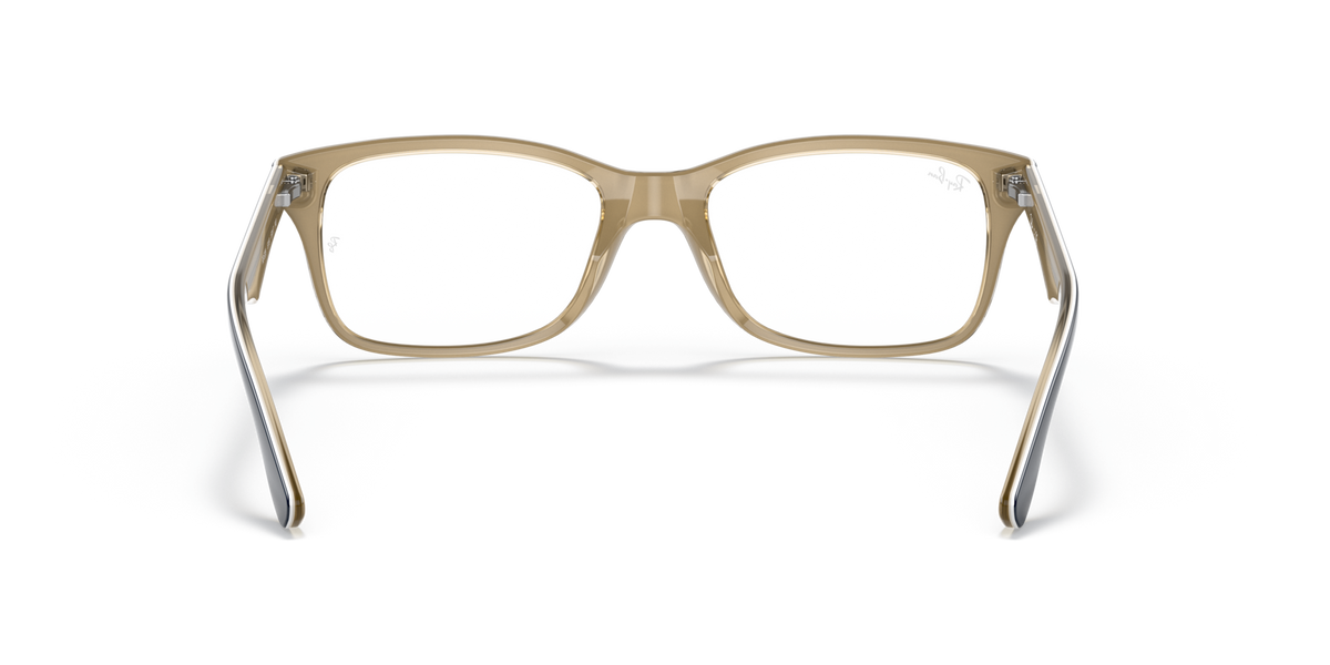 Light tan prescription eyewear frames with rectangular lenses and gold-toned accents