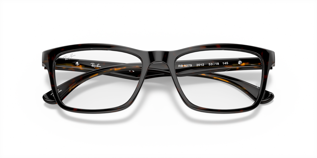 Ray-Ban prescription eyewear frames, black with tortoise temples and rectangular full-rim design.