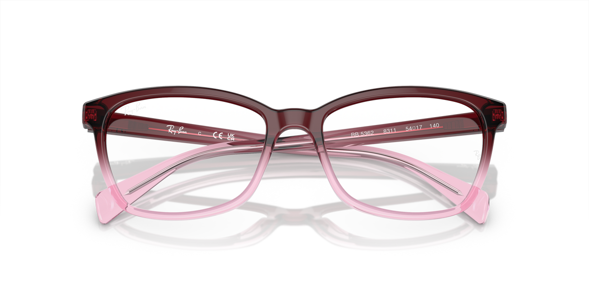 Prescription eyeglass frames with dark maroon front and pink temple details, full view