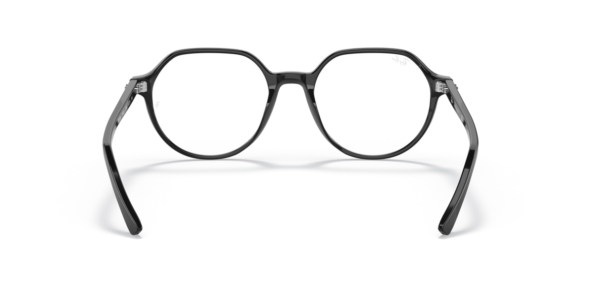 Black prescription eyewear frames with round lenses and curved nose bridge